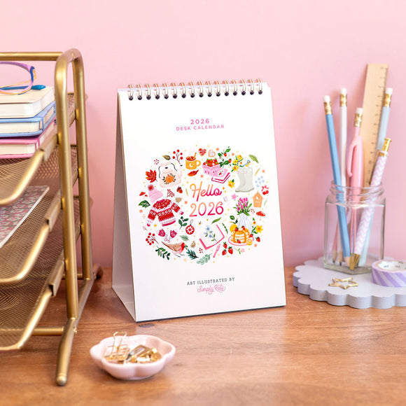 2026 calendar with colorful design on a desk with office supplies